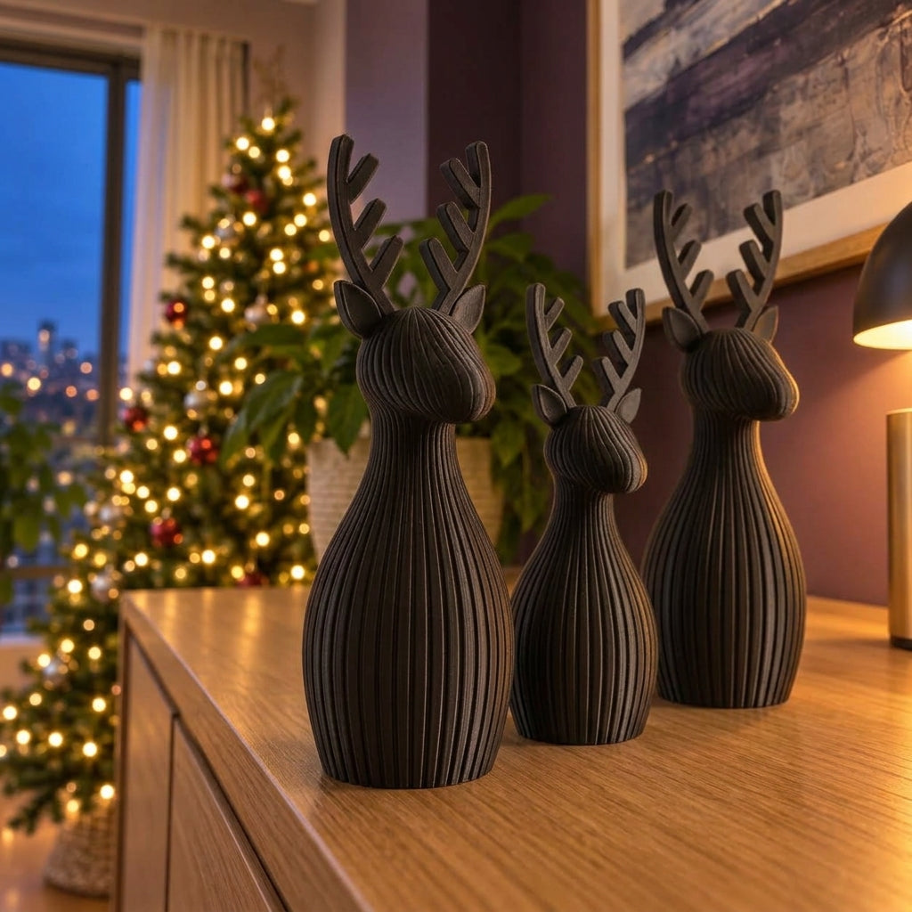 Trío de renos navideños en negro, imagen referencial