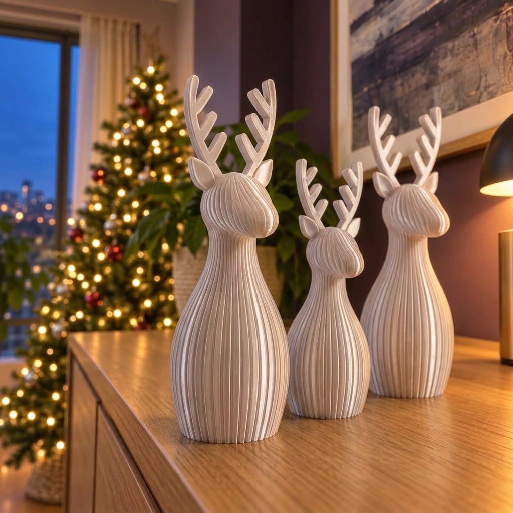 Trío de renos navideños en plateado, imagen referencial