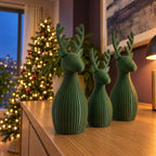 Trío de renos navideños en verde pino, imagen referencial